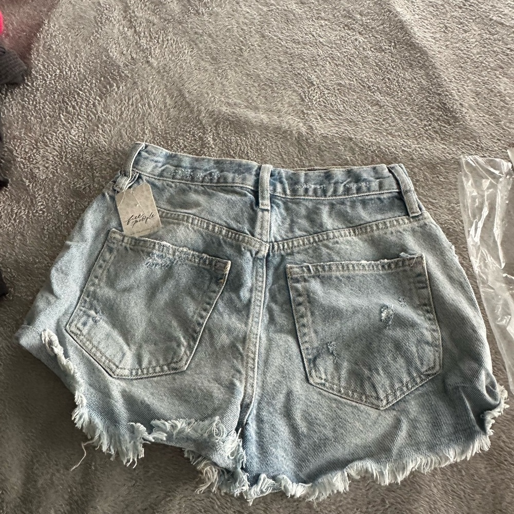 New with tags! Free People Light Wash Distressed Denim Shorts